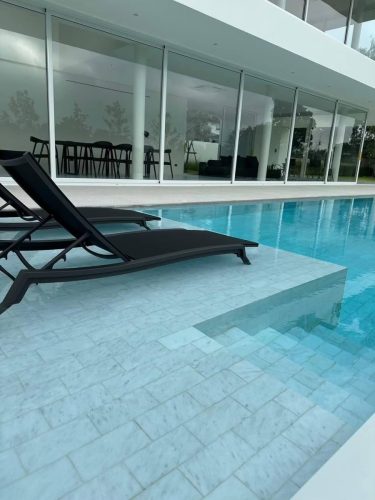 hsn-cordoba-sanded-flooring-exterior-villa-pool-steps-chair